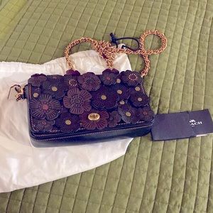 Coach tea rose tan/brown/black floral glovetanned leather dinky crossbody.